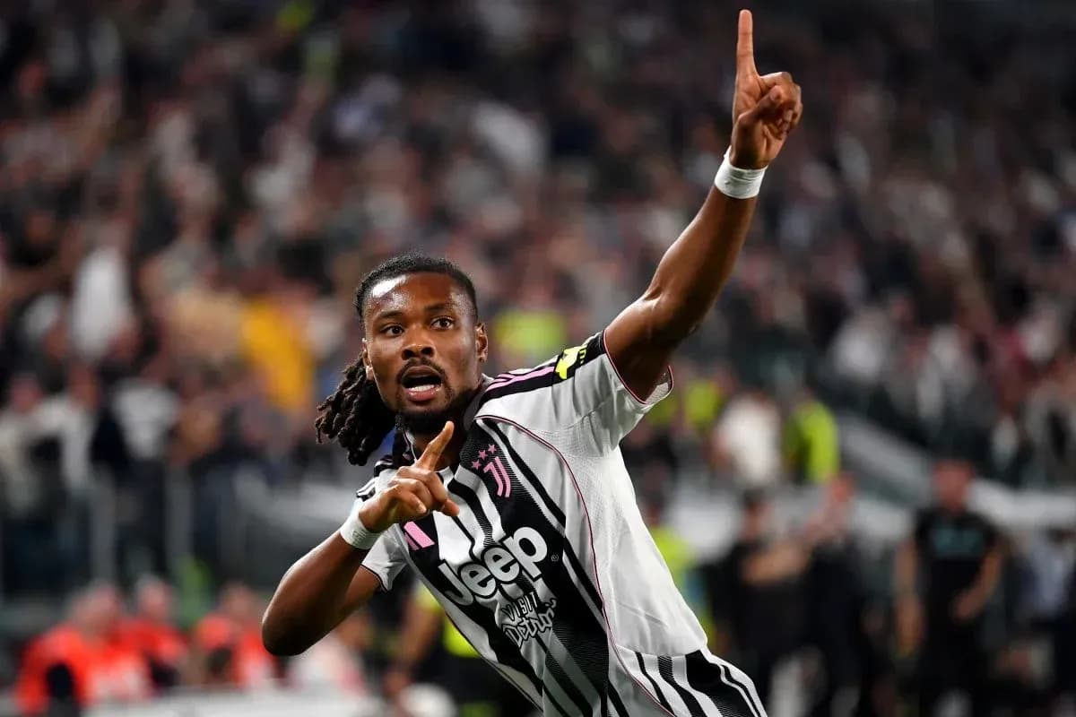 Player celebrating goal with raised finger in stadium Player celebrating goal with raised finger in stadium