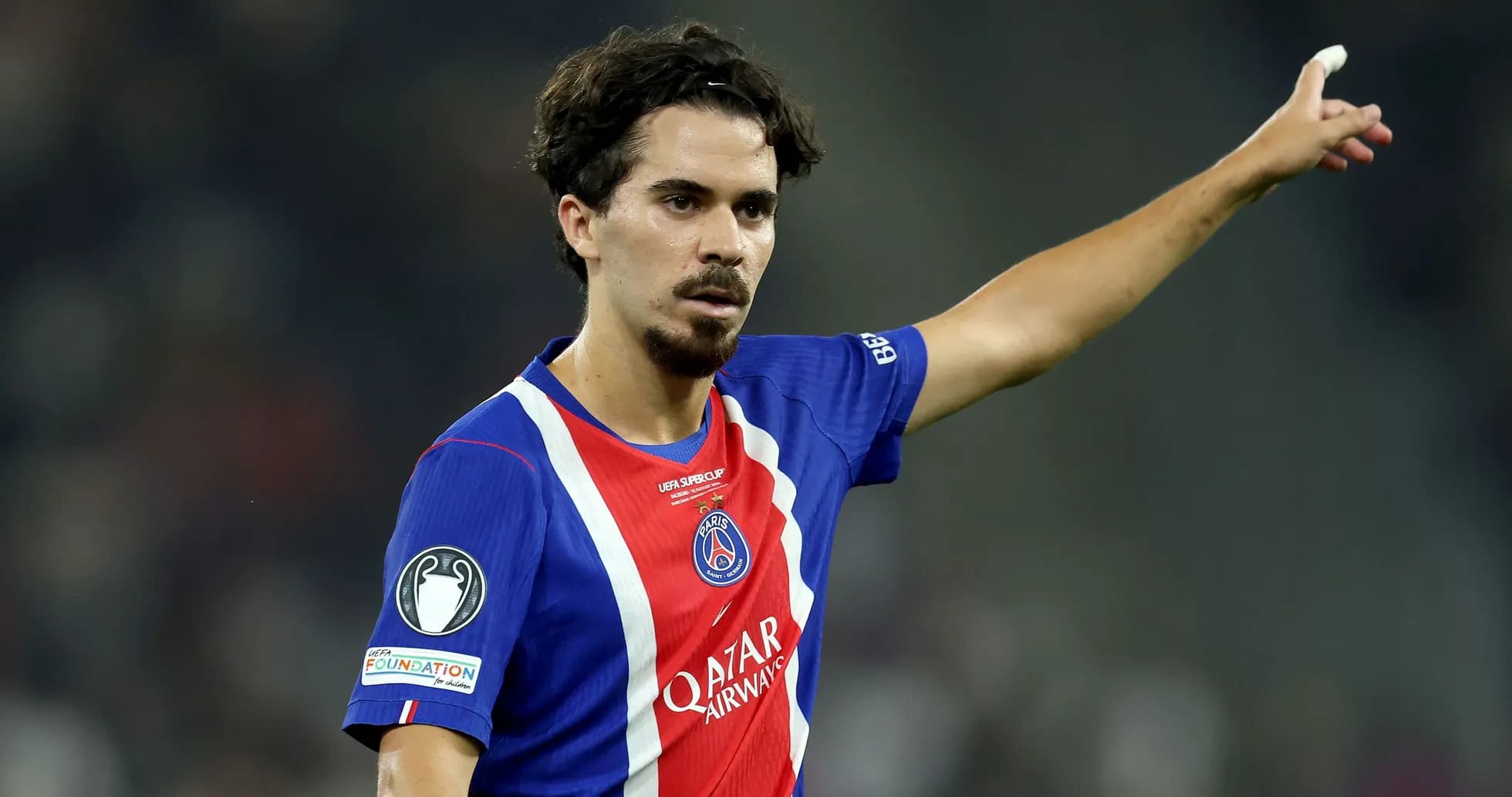Player gesturing during a football match Player gesturing during a football match