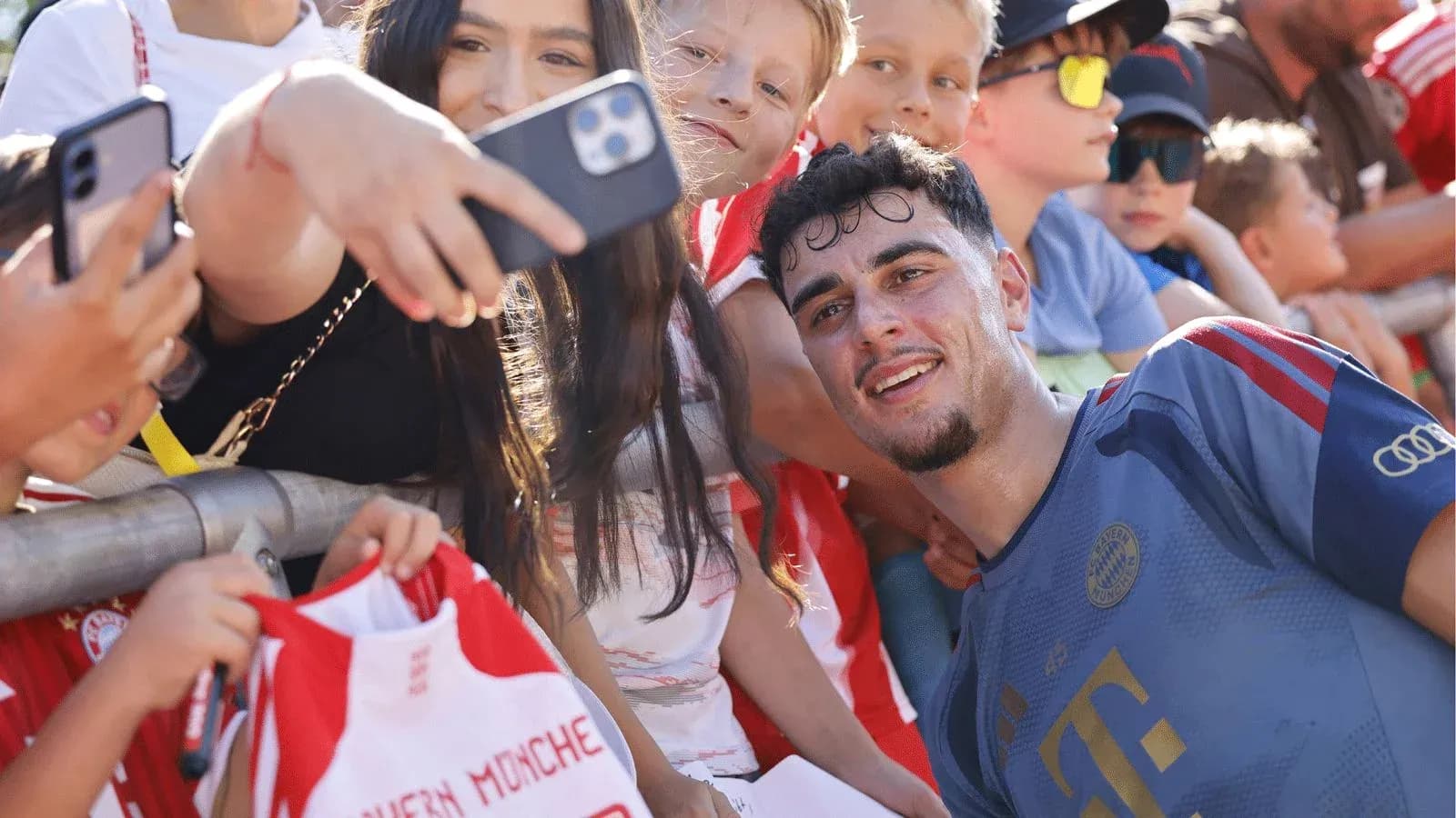 Player taking selfie with young fans after match Player taking selfie with young fans after match