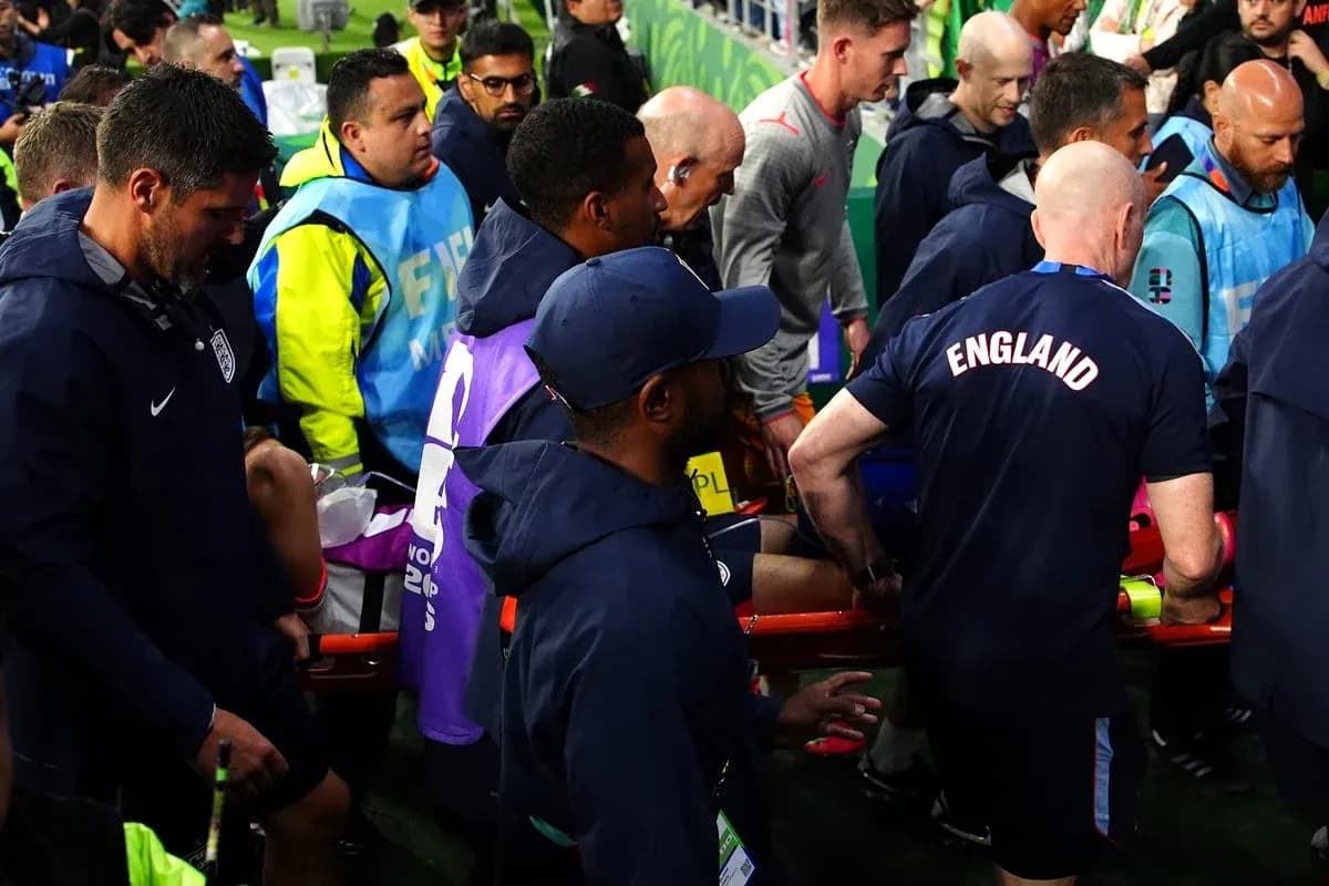 Medical staff assisting player on stretcher during match Medical staff assisting player on stretcher during match