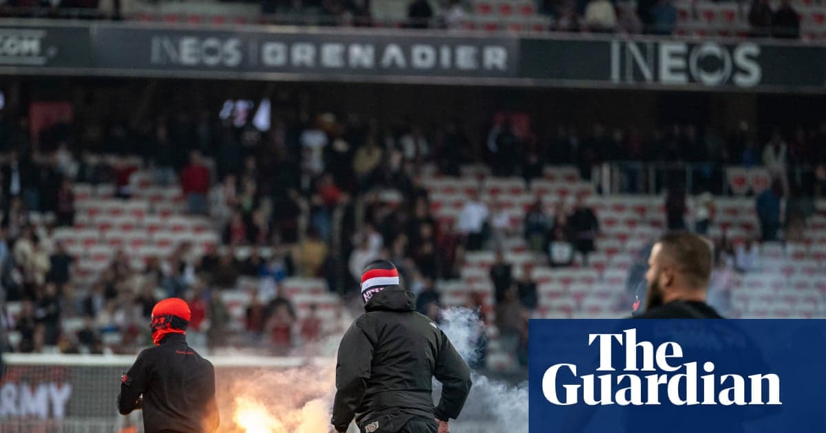 Fans igniting flares in stadium during match Fans igniting flares in stadium during match
