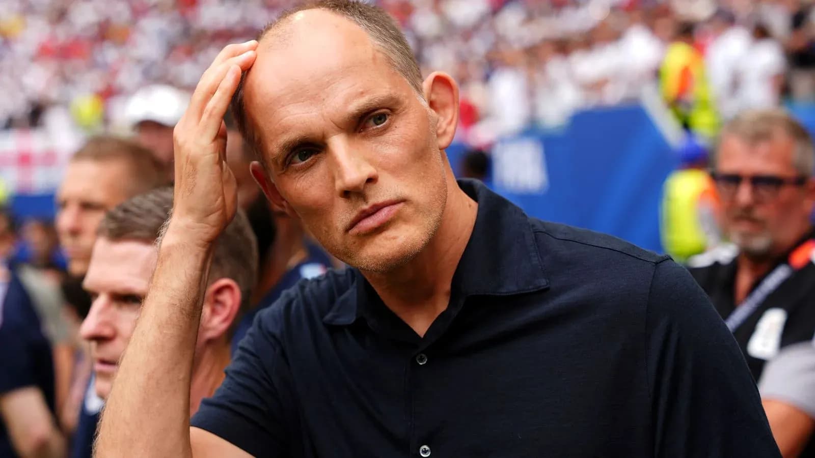 Coach observing the match with concerned expression Coach observing the match with concerned expression