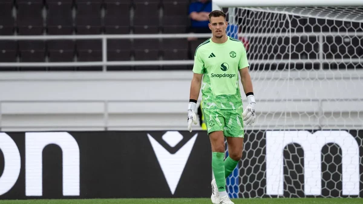 Goalkeeper in green kit during a match Goalkeeper in green kit during a match