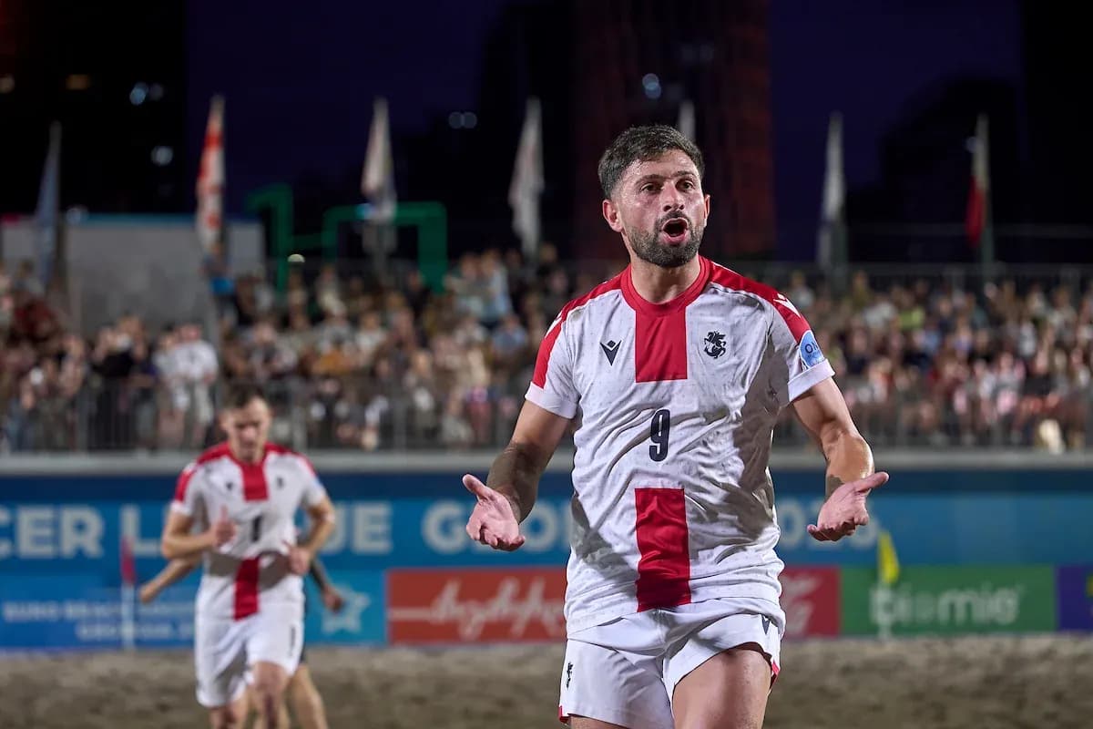 Player celebrating during beach soccer match Player celebrating during beach soccer match