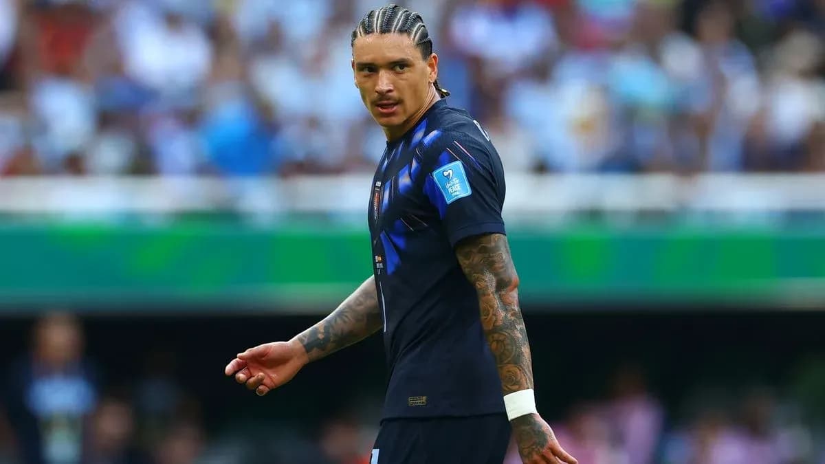 Player in blue jersey walking on field during match Player in blue jersey walking on field during match