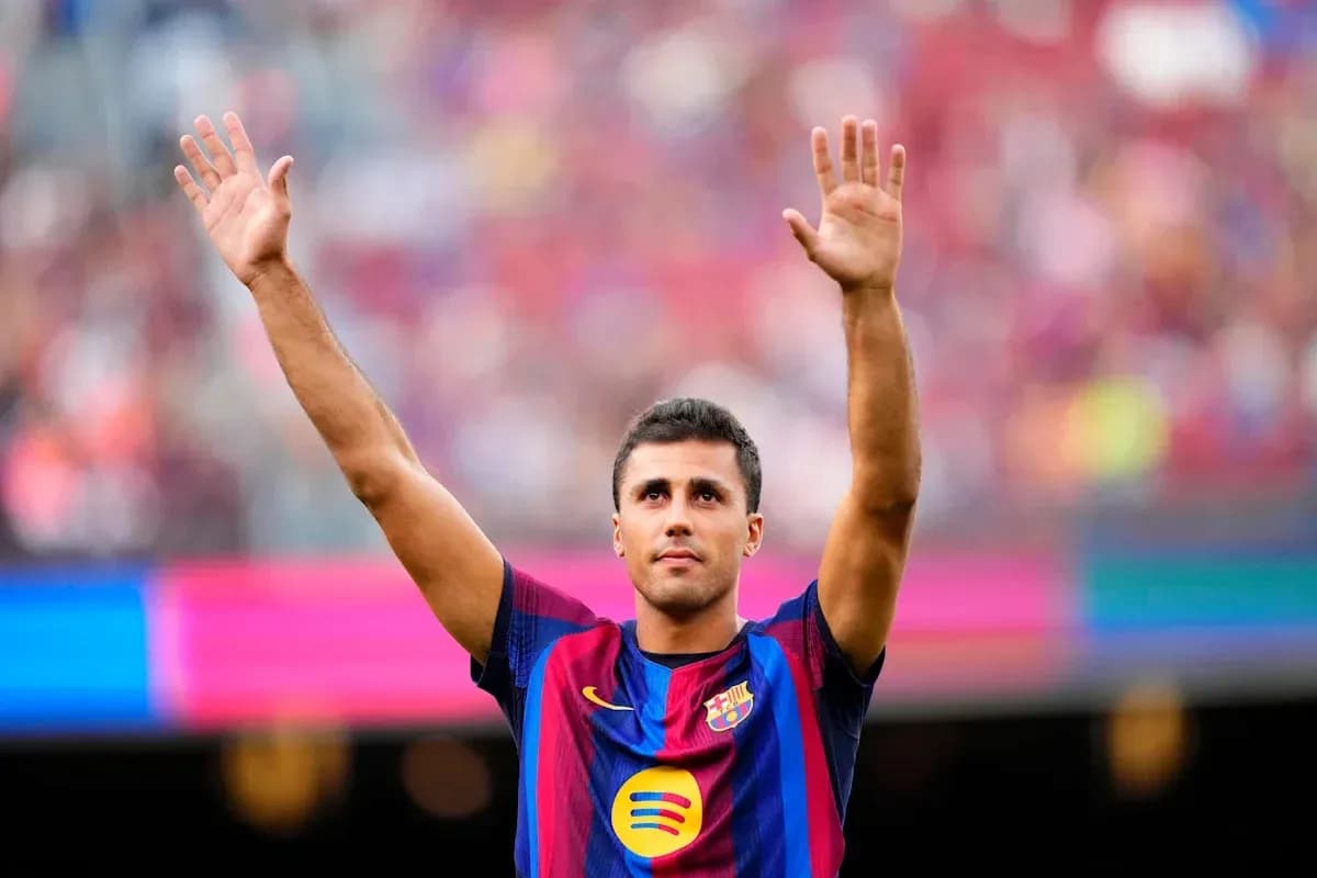 Player raising hands during Barcelona match celebration Player raising hands during Barcelona match celebration