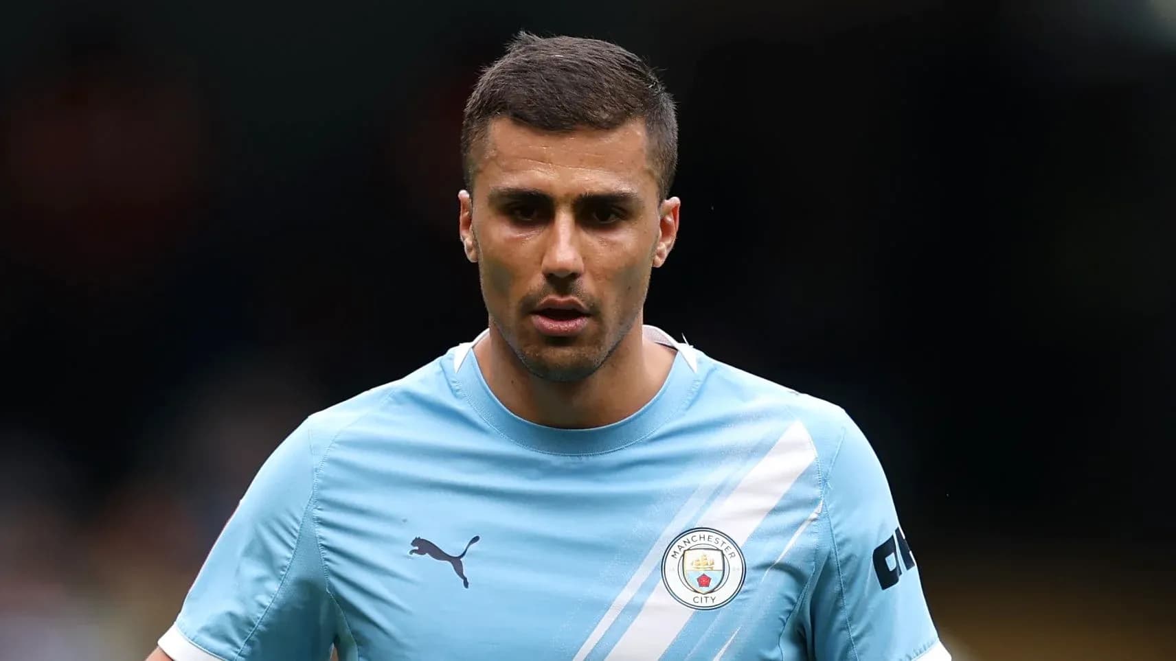 Player wearing Manchester City training kit on field Player wearing Manchester City training kit on field