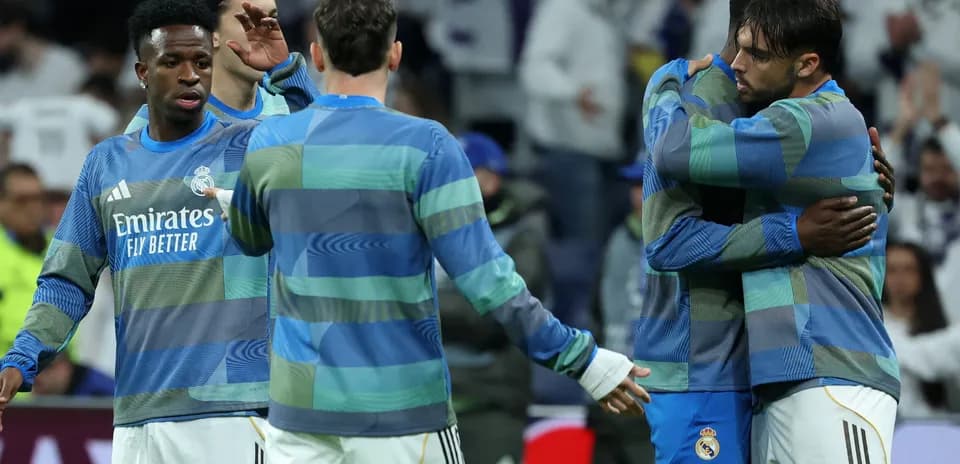 Real Madrid players embracing during warm-up session Real Madrid players embracing during warm-up session