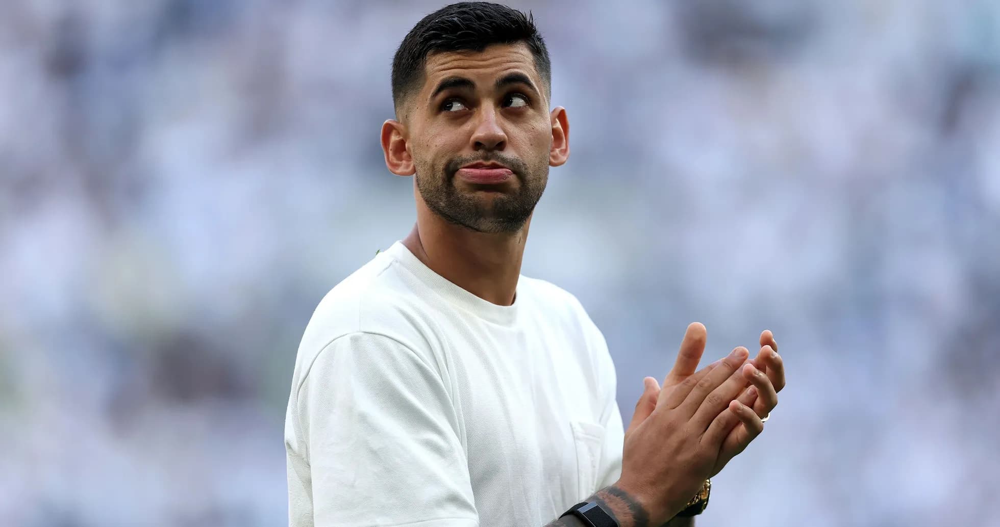 Player clapping and looking up at crowd Player clapping and looking up at crowd