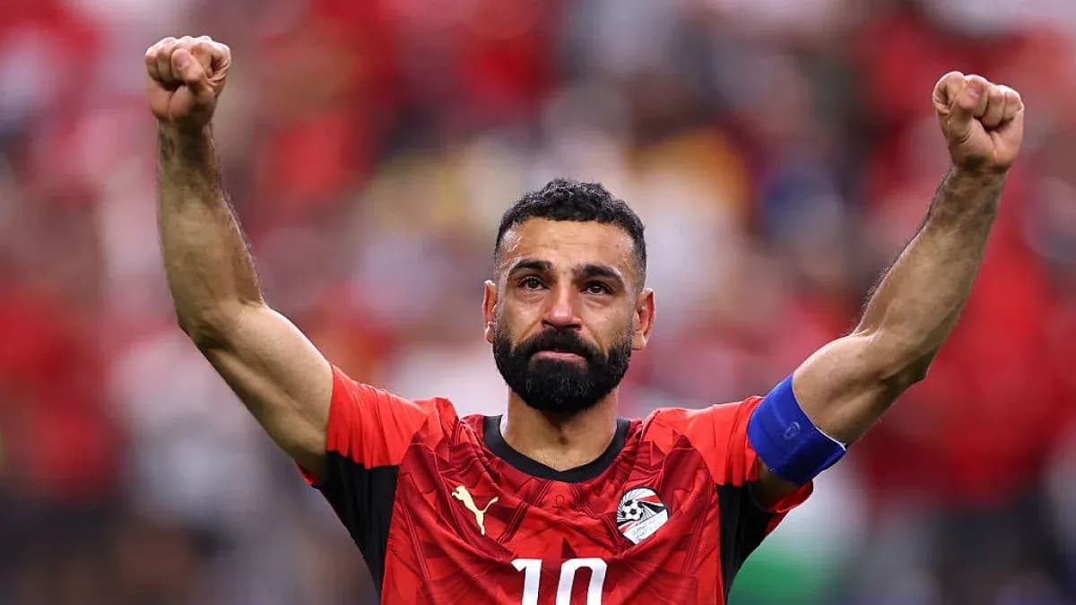 Player celebrating with raised fists in team jersey Player celebrating with raised fists in team jersey