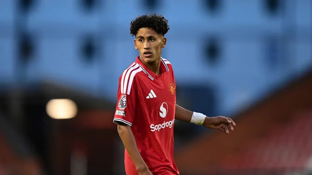 Player in red Manchester United kit during match Player in red Manchester United kit during match