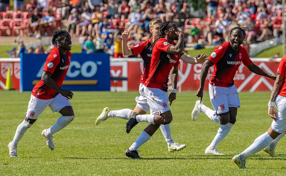 Players celebrating a goal during match Players celebrating a goal during match
