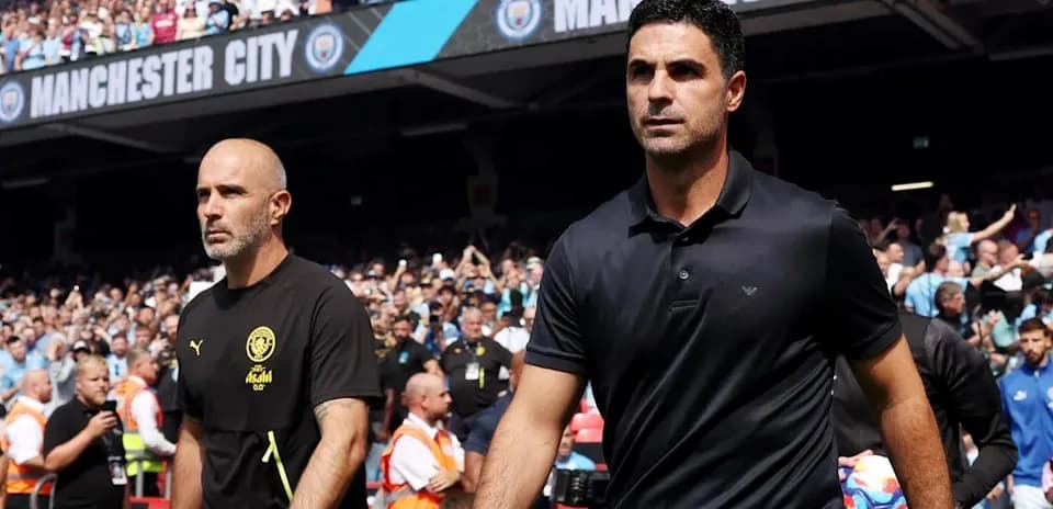 Two football managers walking towards the pitch Two football managers walking towards the pitch