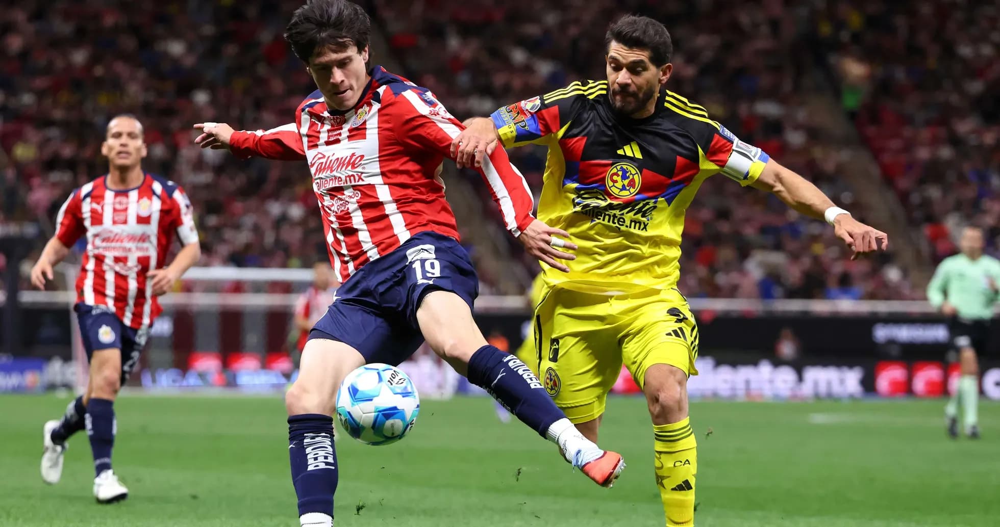Chivas player kicking ball against Club America Chivas player kicking ball against Club America