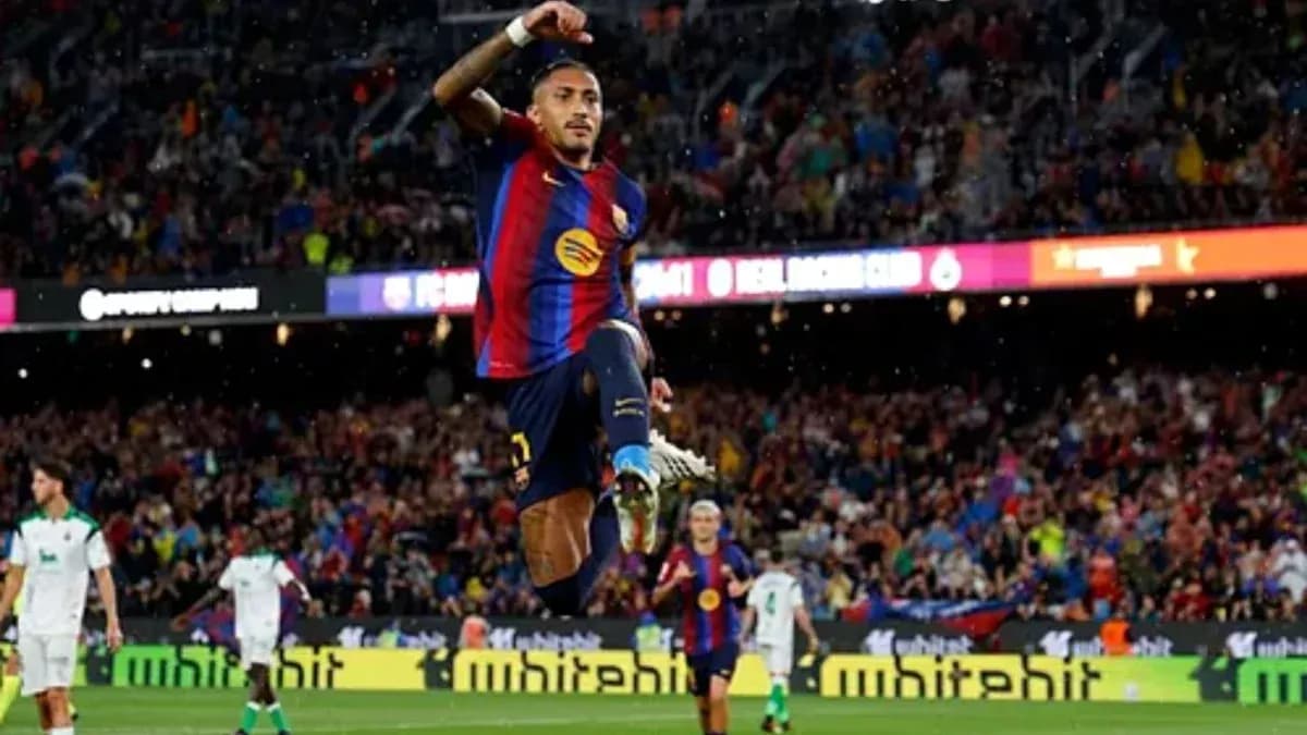 Player celebrating goal with fans at Camp Nou Player celebrating goal with fans at Camp Nou