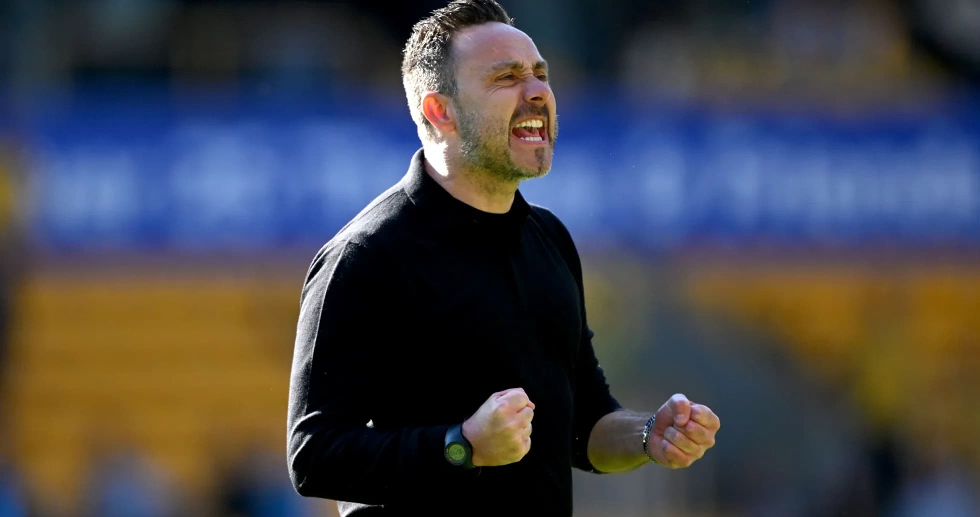 Coach celebrating passionately during a match Coach celebrating passionately during a match