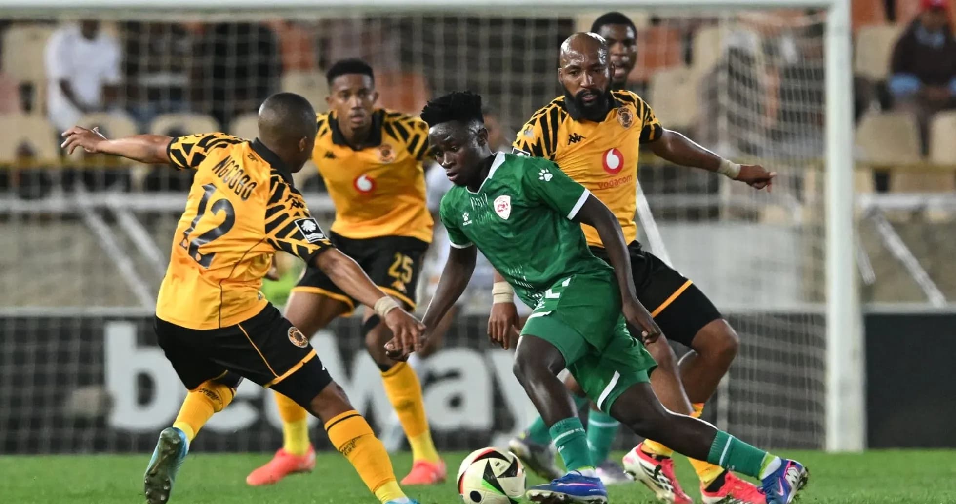 Player dribbling past opponent during football match Player dribbling past opponent during football match