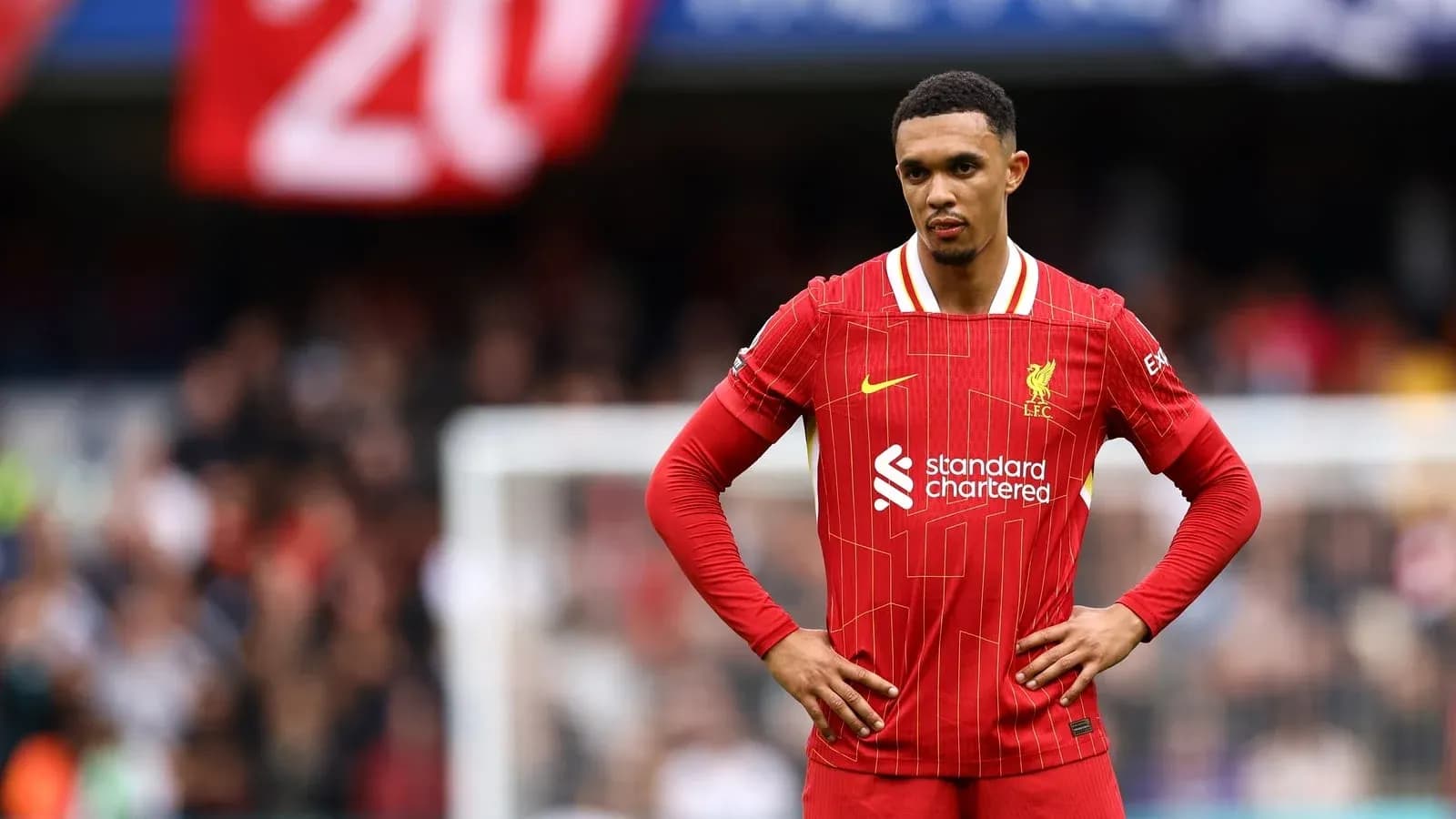 Trent Alexander-Arnold standing on the pitch during match Trent Alexander-Arnold standing on the pitch during match