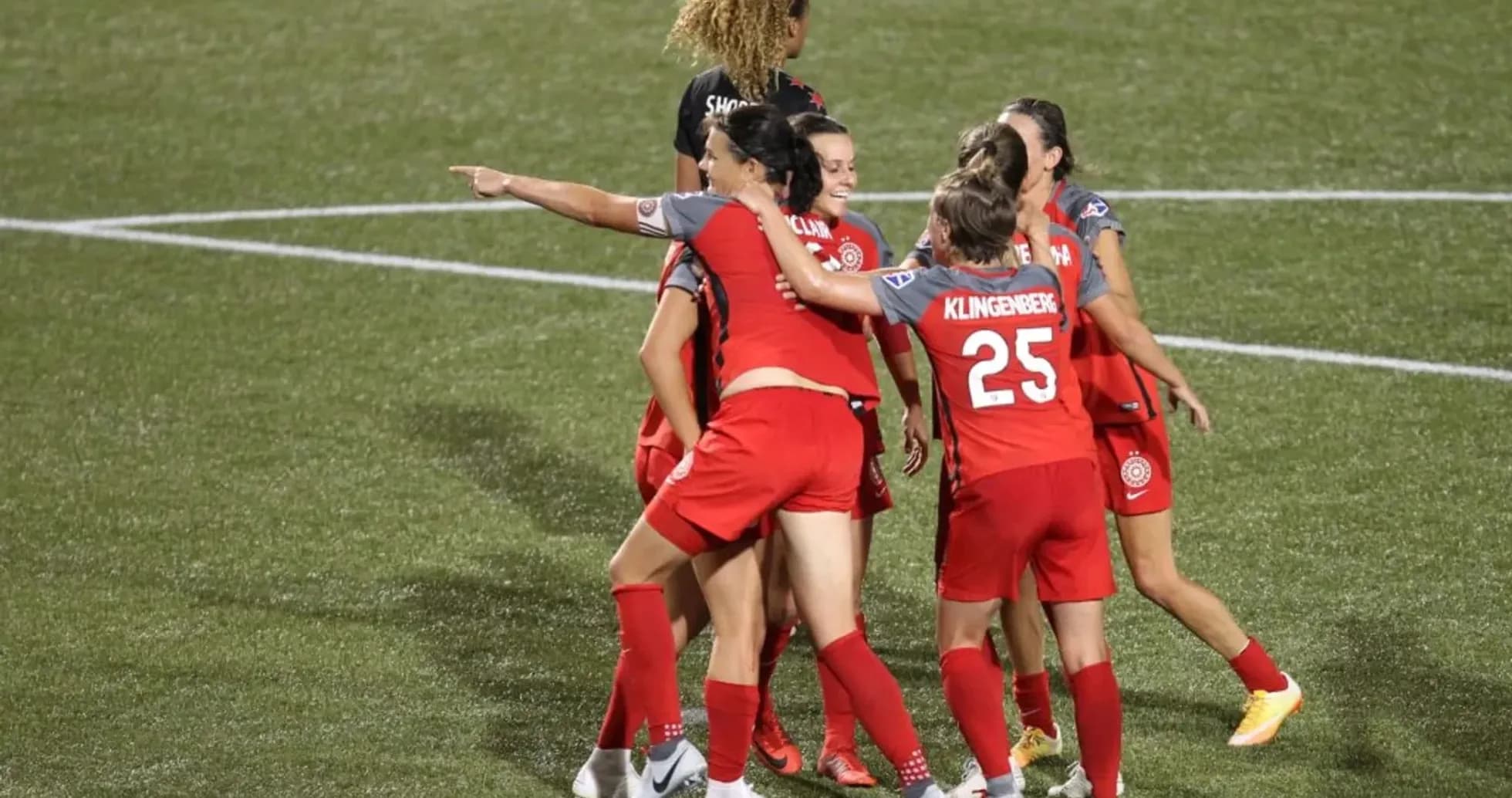 Portland Thorns players celebrating a goal Portland Thorns players celebrating a goal