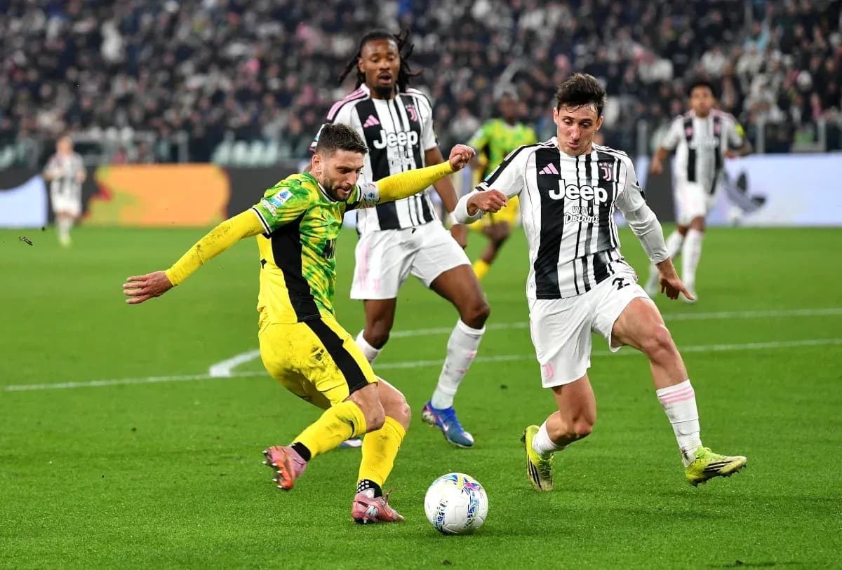 Players contesting the ball during a football match Players contesting the ball during a football match