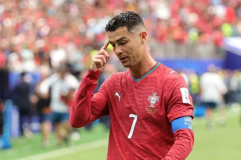 Cristiano Ronaldo during match, touching his head Cristiano Ronaldo during match, touching his head