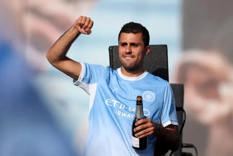 Player celebrating with champagne after match Player celebrating with champagne after match
