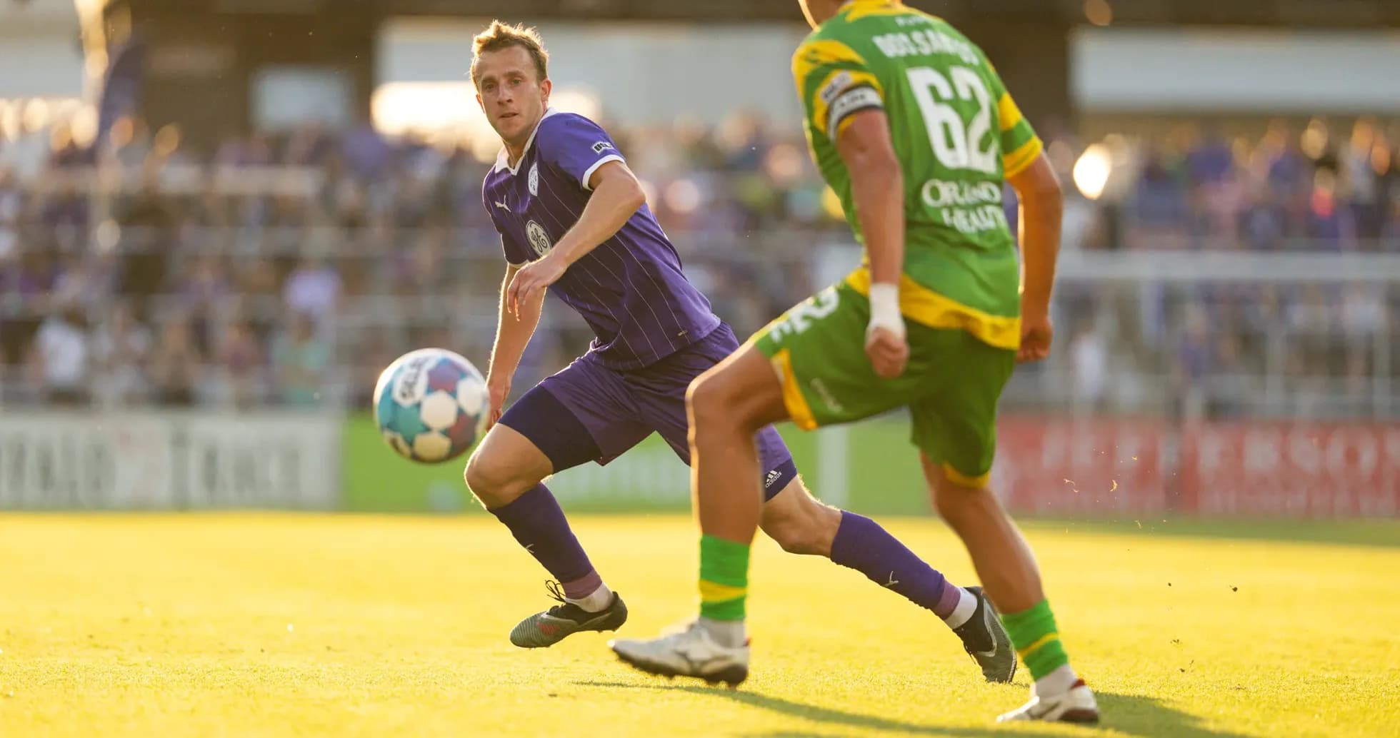 Player passing ball during Louisville City match Player passing ball during Louisville City match