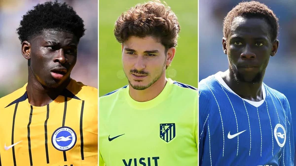 Three football players in club jerseys during training Three football players in club jerseys during training