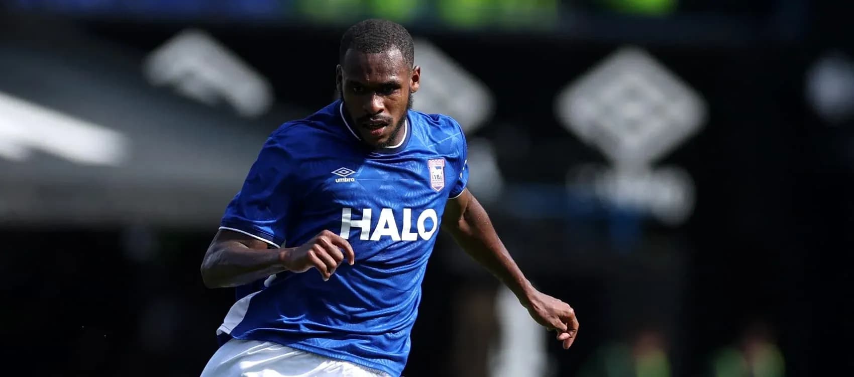 Player running in blue jersey during match Player running in blue jersey during match