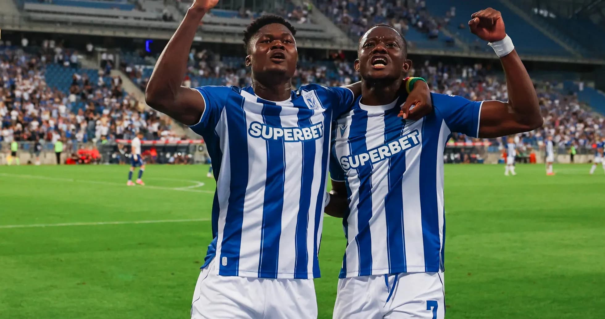 Two players celebrating after scoring a goal Two players celebrating after scoring a goal