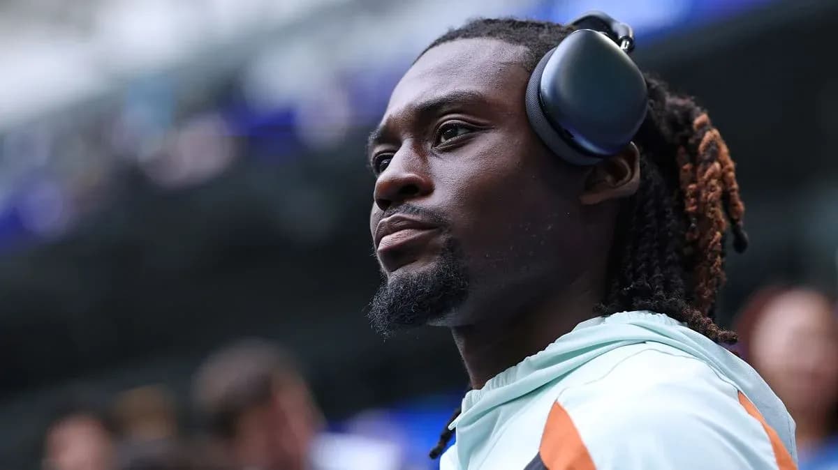 Player wearing headphones before the game Player wearing headphones before the game
