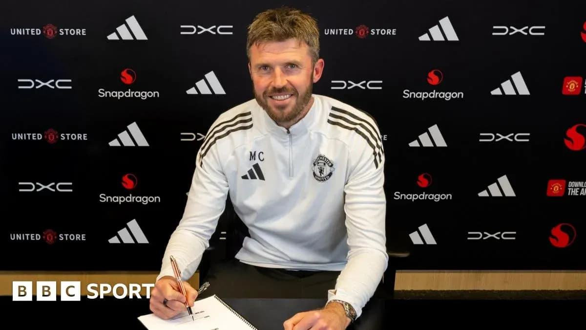 Coach signing contract at Manchester United press event Coach signing contract at Manchester United press event