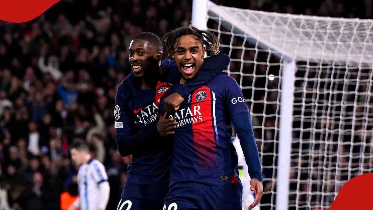 Two PSG players celebrating a goal together Two PSG players celebrating a goal together