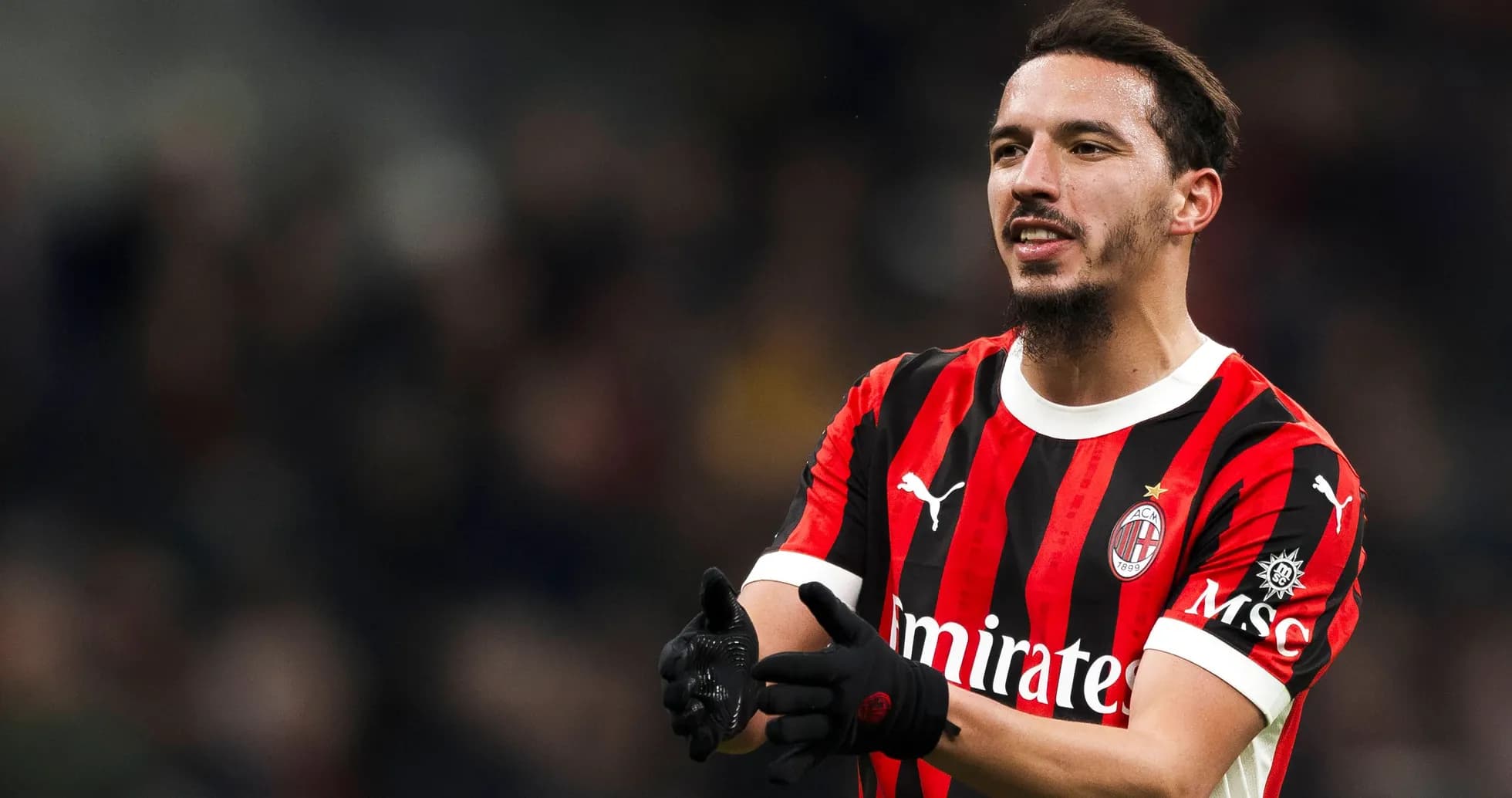 Player in AC Milan jersey gesturing during match Player in AC Milan jersey gesturing during match