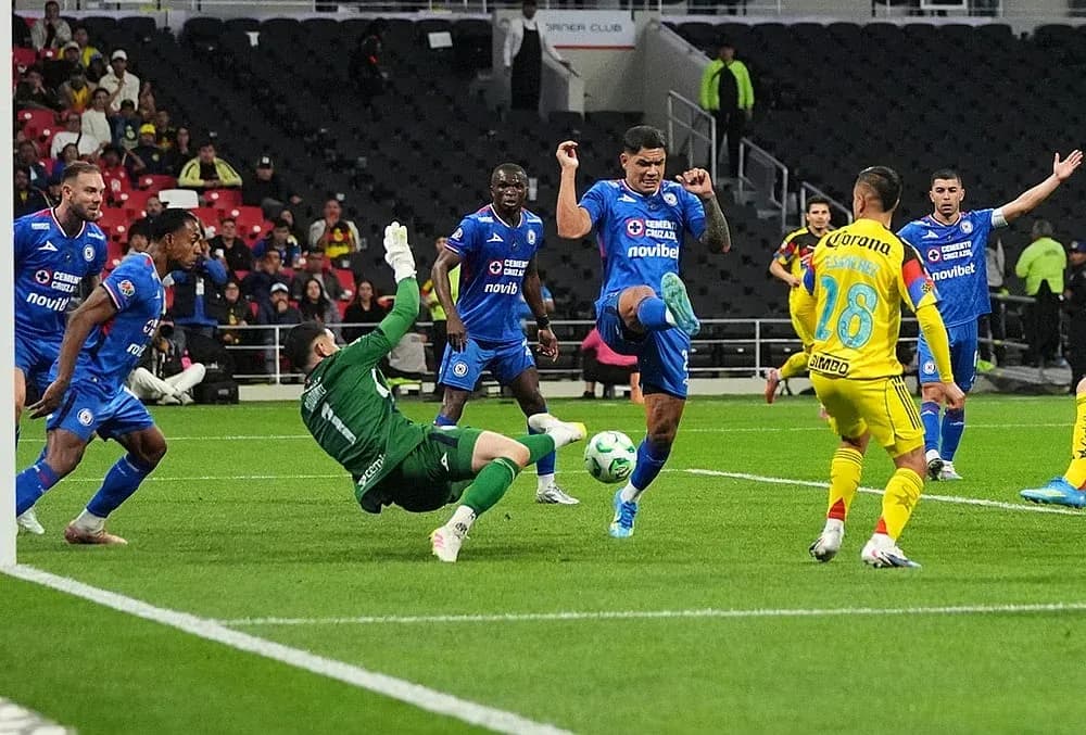 Cruz Azul player attempting to score against Club America Cruz Azul player attempting to score against Club America