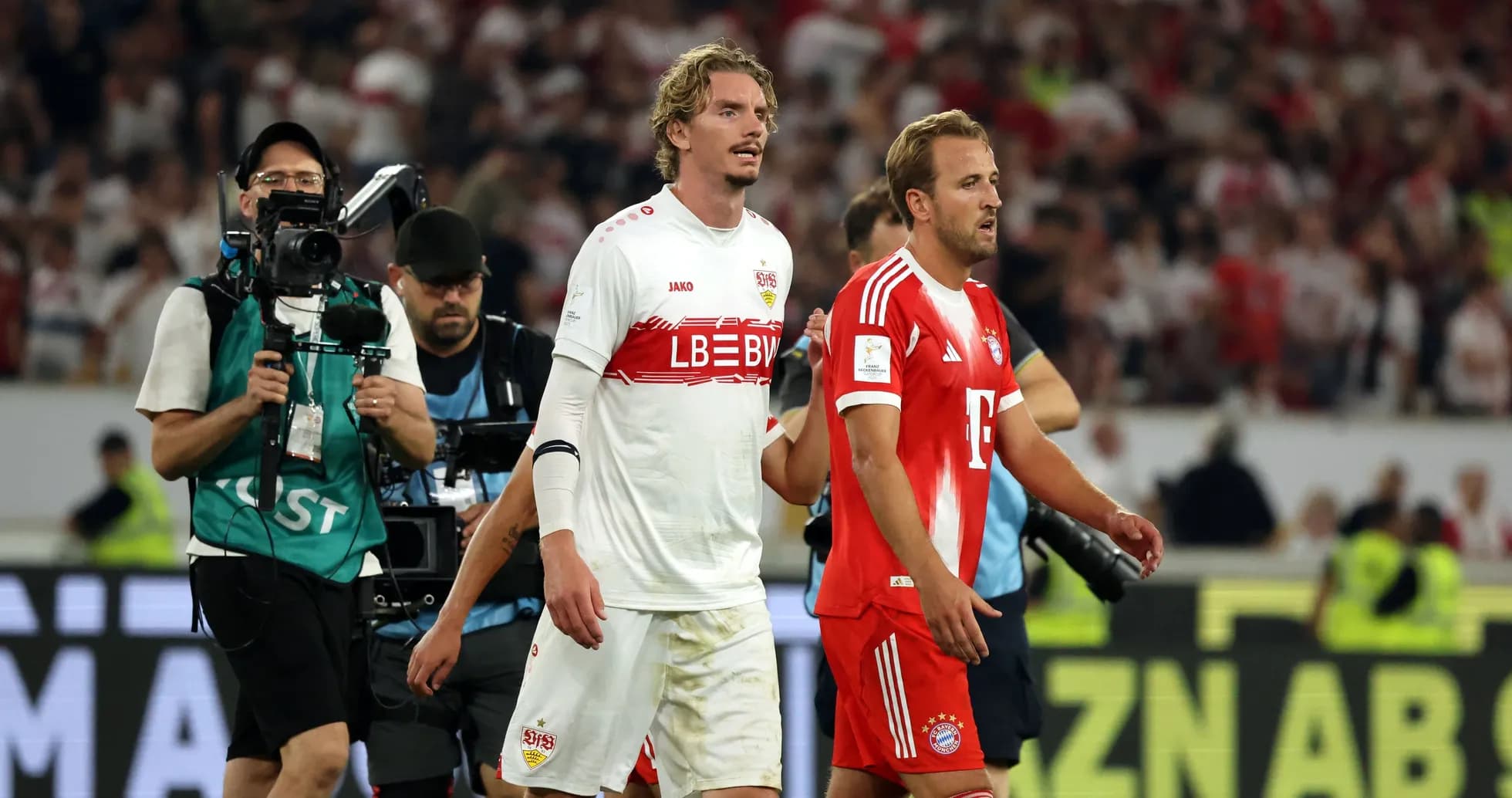 Players walking off pitch after match conclusion Players walking off pitch after match conclusion