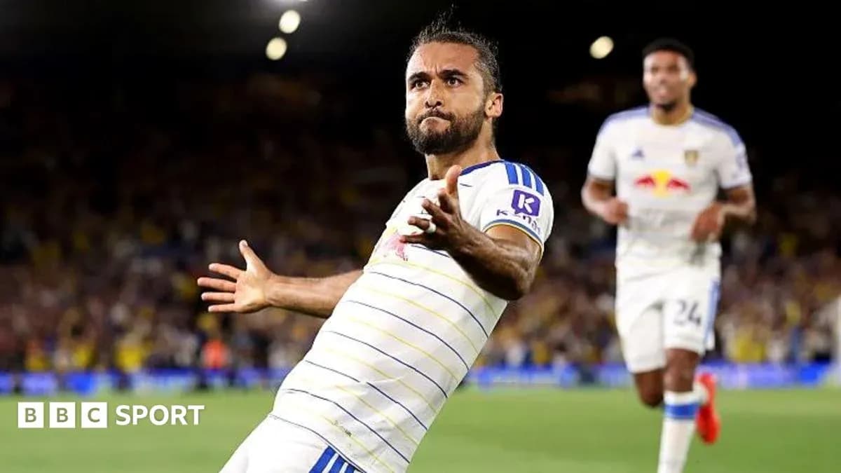 Player celebrating a goal on the pitch Player celebrating a goal on the pitch