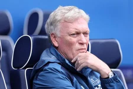 Coach sitting on bench during match Coach sitting on bench during match