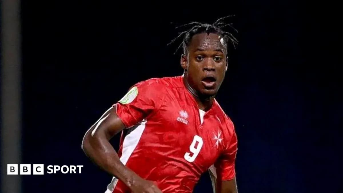 Player in red jersey during soccer match action Player in red jersey during soccer match action
