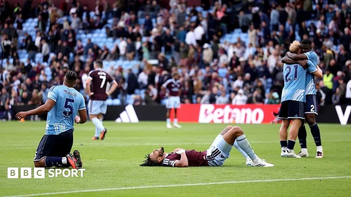 Players reacting after match with fans in background Players reacting after match with fans in background