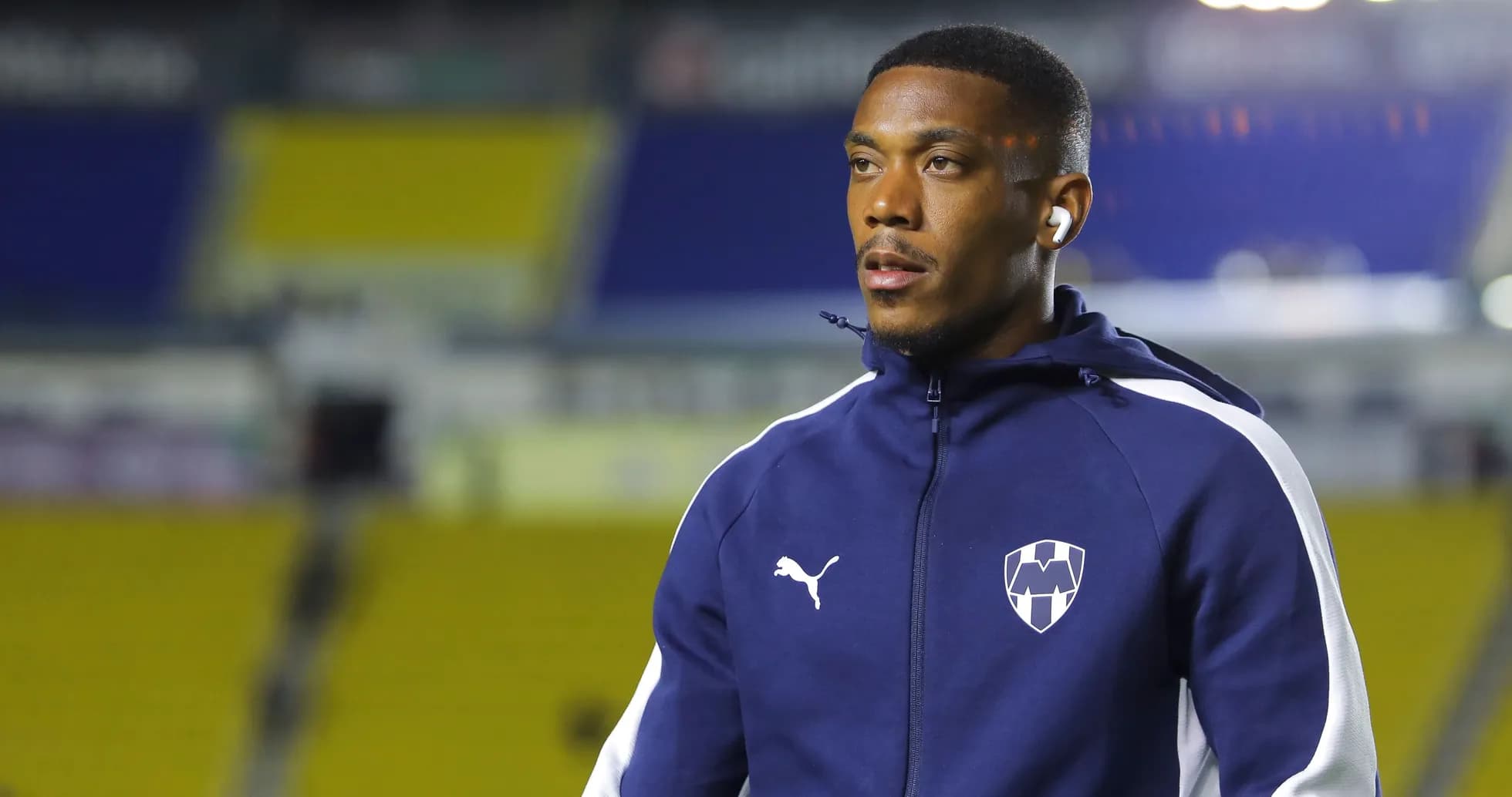 Player in Puma training jacket at stadium Player in Puma training jacket at stadium