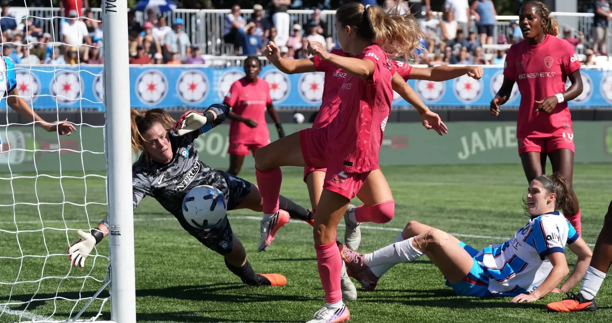 Goalkeeper diving to save shot during match Goalkeeper diving to save shot during match