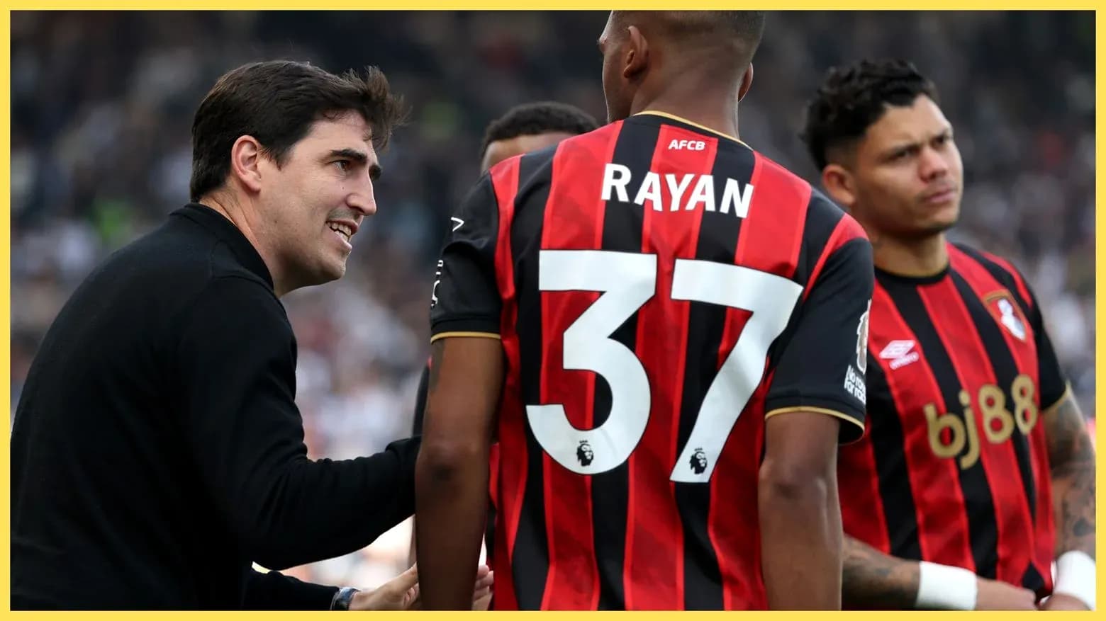 Coach discussing strategy with AFC Bournemouth players Coach discussing strategy with AFC Bournemouth players
