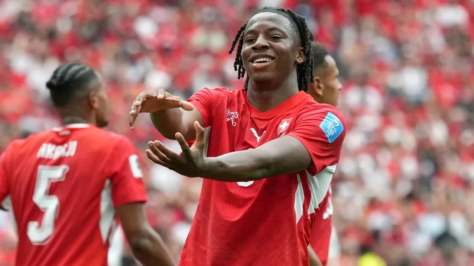 Player celebrating with teammates during match Player celebrating with teammates during match