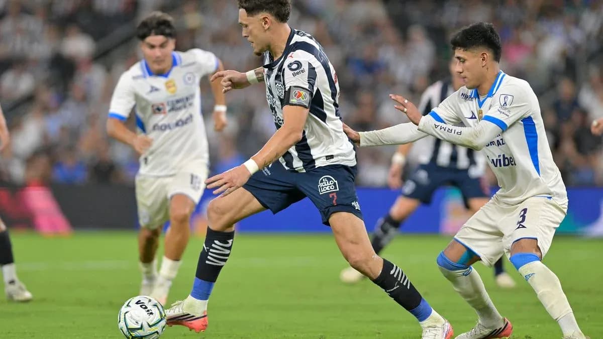 Monterrey player dribbling past Cruz Azul defender Monterrey player dribbling past Cruz Azul defender