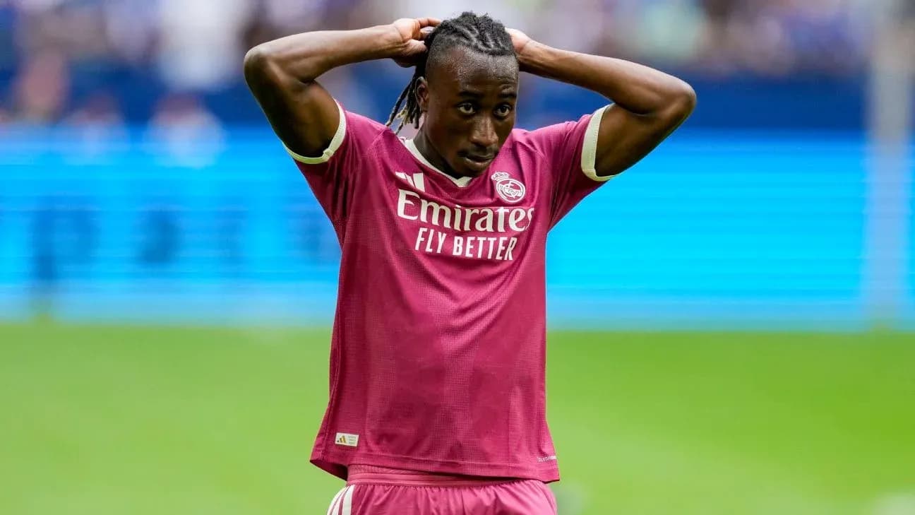Player in pink Real Madrid kit with hands on head Player in pink Real Madrid kit with hands on head