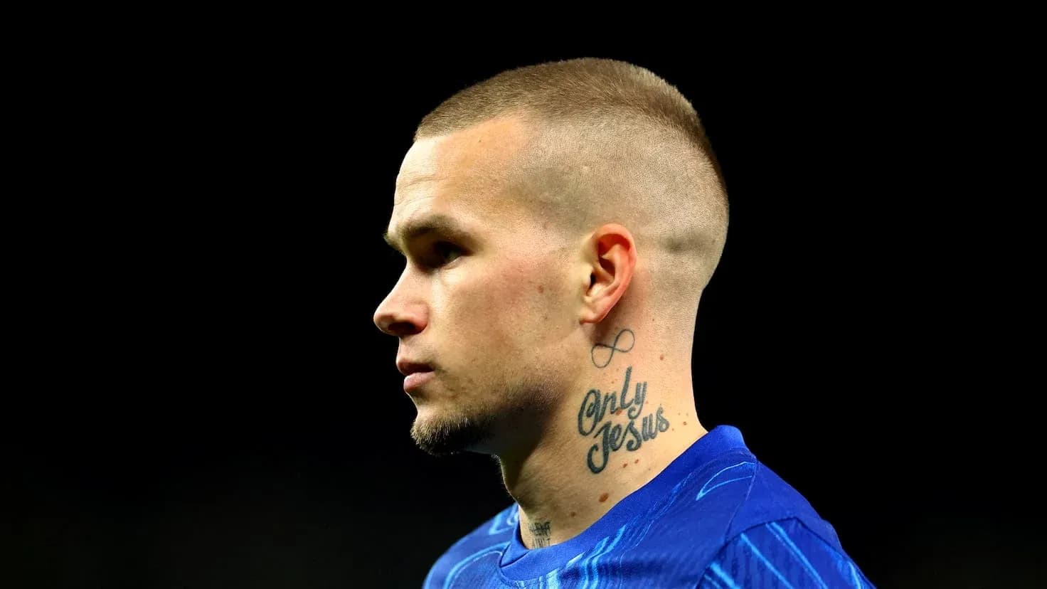 Player in blue jersey with tattoos on neck Player in blue jersey with tattoos on neck