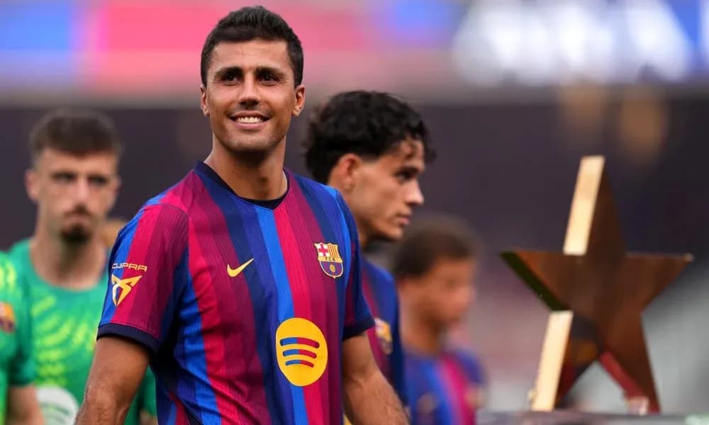 Player smiling while holding a star trophy Player smiling while holding a star trophy