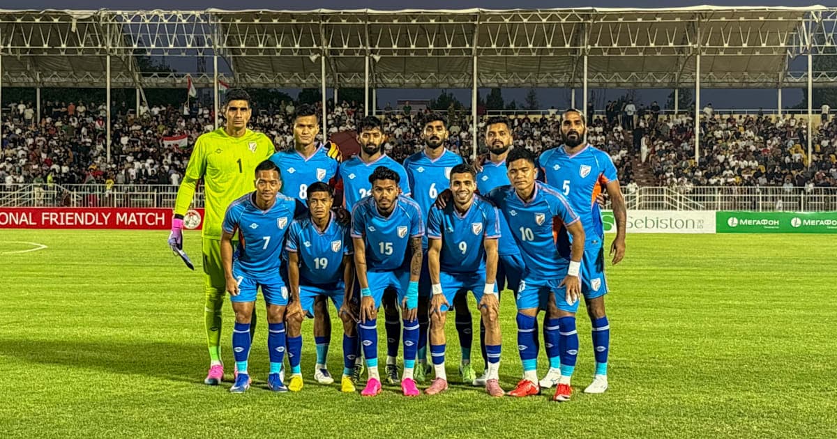 Football team posing for photo before friendly match Football team posing for photo before friendly match