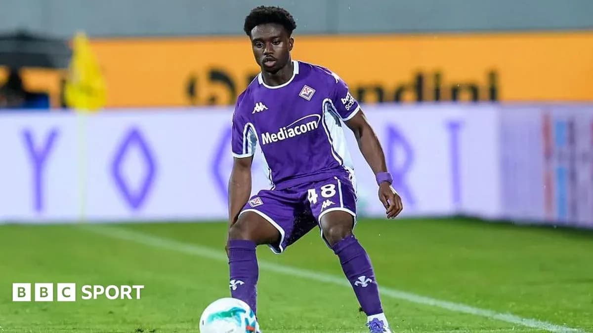 Player in purple Fiorentina kit on the pitch Player in purple Fiorentina kit on the pitch